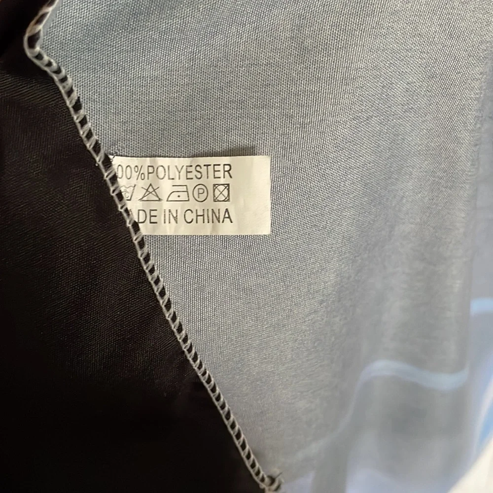 Black Tapestry with Blue Letters Graphic.